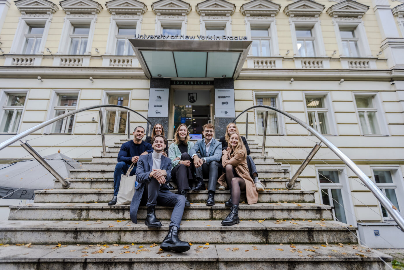 UNYP students pose for a photo at the entry to the main campus.