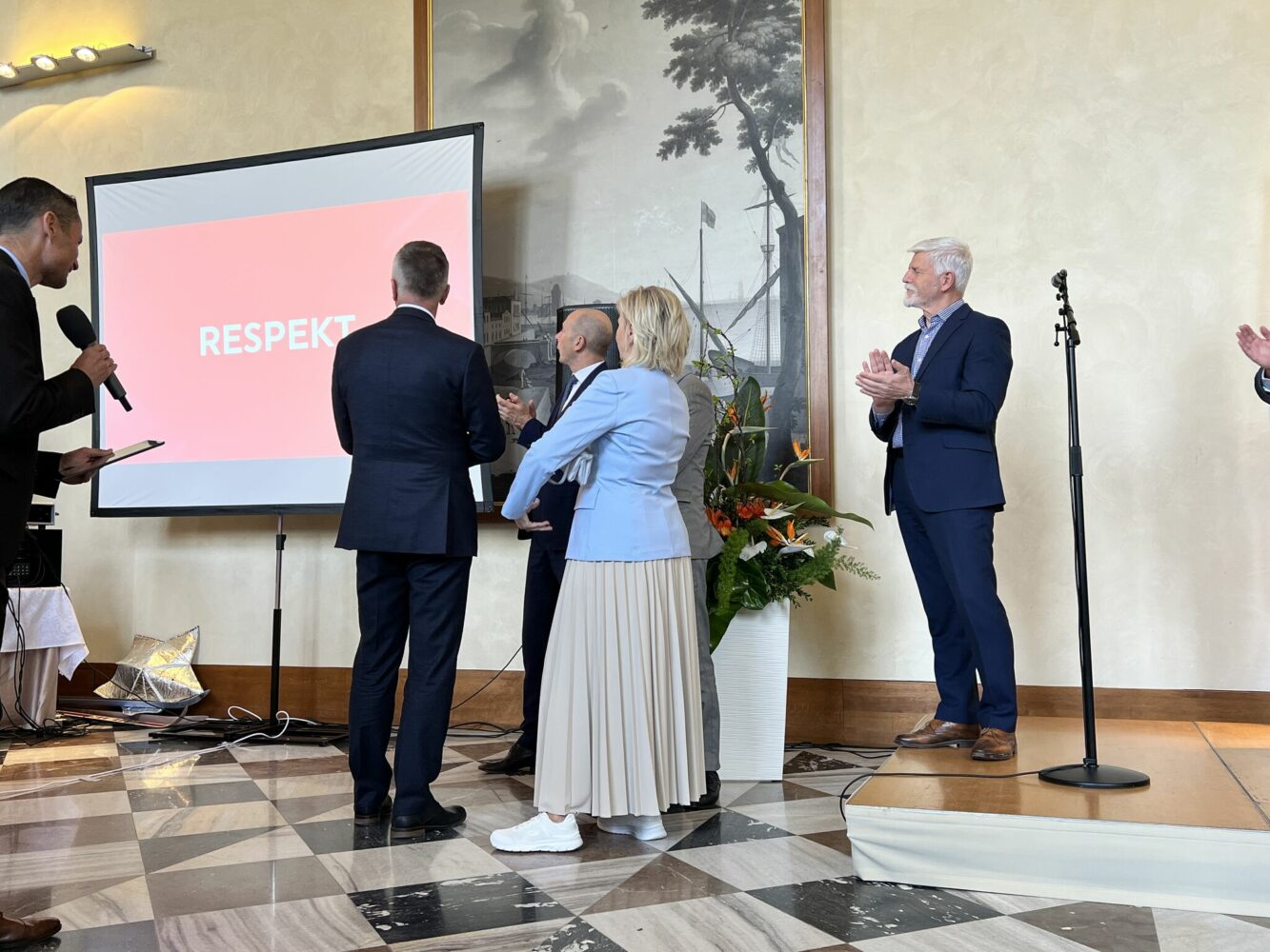 Czech President watches a presentation from the Winter Olympics at the Prague Castle